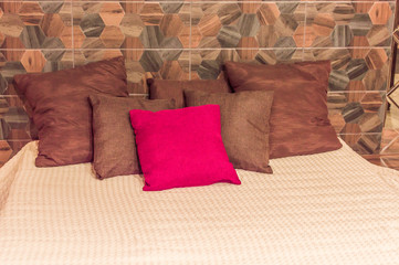 bed with throw pillows close up