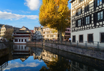 Fototapeta na wymiar Petit France medieval old town district of Strasbourg with canal and reflections, Alsace France, retro toned