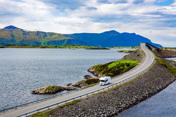 Caravan car RV travels on the highway Atlantic Ocean Road Norway.