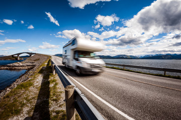 Caravan car RV travels on the highway Atlantic Ocean Road Norway.