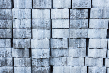 The pavement block brickwork prepared for workingbackground texture. New blocks for sidewalk are stacked in the brickwork and prepared for working