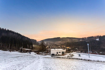 modern house in rural winter landscape