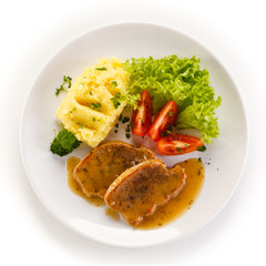 Fried pork chop, puree and vegetables