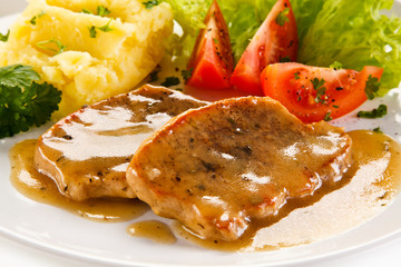 Fried pork chop, puree and vegetables