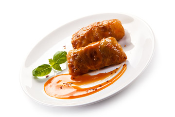 Wrapped meat with tomato sauce on white background