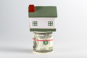 Stack of dollars as a Foundation to a house