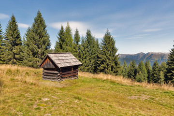 Fototapeta na wymiar Alpine woods landscape with hunting lodge in Western Carinthia, Austria.