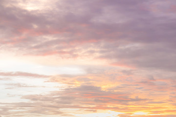 Naklejka na ściany i meble Dramatic sunset and sunrise sky with beautiful and colorful nice soft cloud background concept.