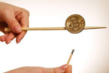 Fototapeta na wymiar Chopsticks with bitcoin isolated on white background