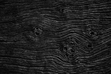 Black gnarl wood texture for background