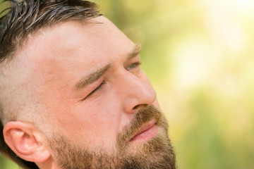 Young handsome bearded man with mohawk hairstyle