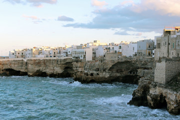 Fototapeta premium Polignano a Mare enters with the Bastion of Santo Stefano on the right