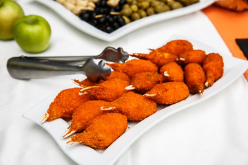 Hot and Spicy Buffalo Chicken Wings. Hot Meat Dishes - Fried Chicken Wings in a white plate