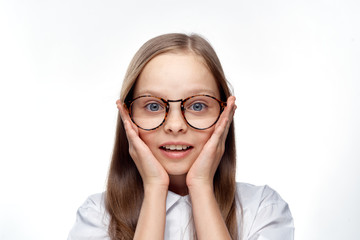 Fototapeta premium cute girl with glasses holds on to her face
