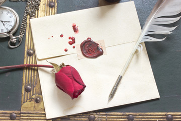 Wax sealed love letter with rose and quill on vintage background