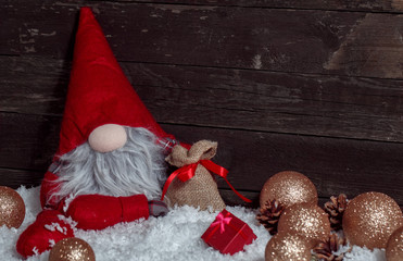 Christmas scene with Xmas dwarf decoration and snow.