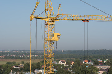 old yellow tower crane