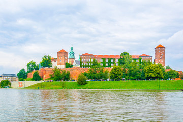 Wawel castle in the polish city Krakow/Cracow reflected on the Vistula/Wisla river.