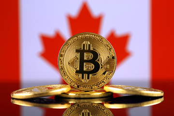 Physical version of Bitcoin (new virtual money) and Canada Flag. Conceptual image for investors in...