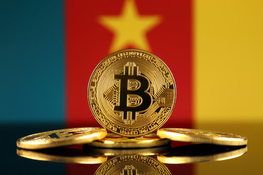 Physical version of Bitcoin (new virtual money) and Cameroon Flag. Conceptual image for investors in cryptocurrency and Blockchain Technology in Cameroon.