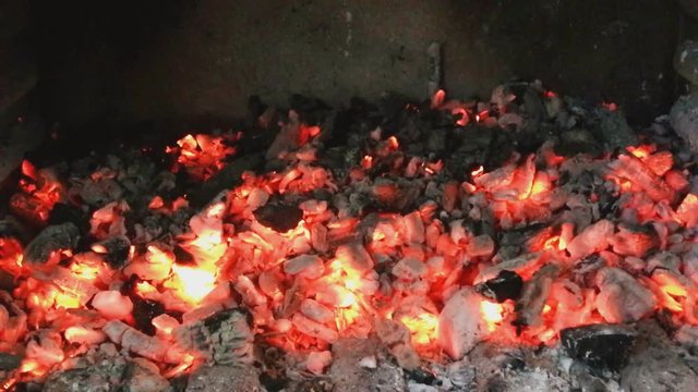 Buring charcoal in the grill, ready for barbecue