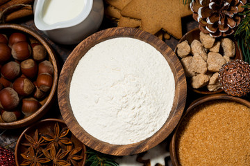 ingredients for Christmas baking on dark background, top view closeup