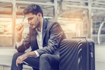 Businessman are lose to earn a profit from doing business. Male holding dollar currency. Concept of...