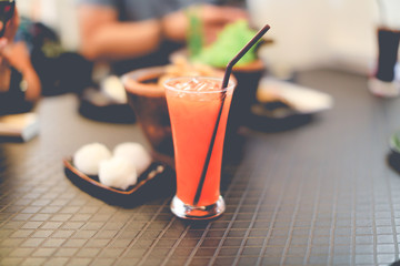 Fruit juice on the table, photo tone
