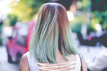 Woman with Colorful hair standing in Chiang Mai city Thailand, photo toned, Girl in park in the evening