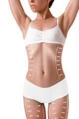 Female body with the drawing arrows on it isolated on white. Fat lose, liposuction and cellulite...