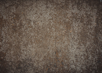 Khaki grey brown weathered stucco exterior pattern.