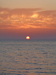 Marine sunset, sun go down in the sea, colorful sky