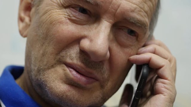 Elderly Man Talking On Mobile Phone