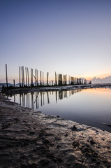 Obraz premium sunrise light on the beach with muddy wave , clay wave 