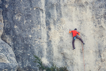 Naklejka premium A man climbs the rock.