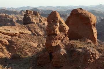 Fototapeta na wymiar Red rock formations in the canyon of Boysun, Surkhandarya region.Uzbekistan.