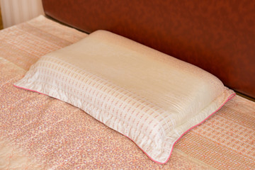 pillow on a bed in a bed room