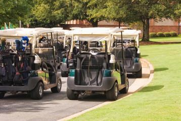 Electric Golf Carts Parked Outdoors