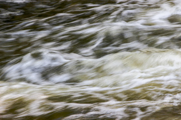 Water blured background with river, wave close up nature .