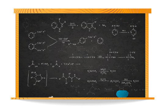 Basic chemical reaction equations and formulas on school blackboard in wooden frame isolated on white