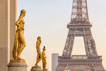 Fotobehang Golden bronze statues on Trocadero square, Eiffel tower in the background, Paris France © Delphotostock