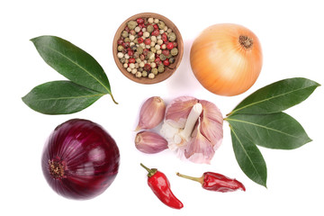 mix of onion, garlic, hot pepper, peppercorn and laurel leaf isolated on white background. Top view