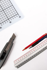 Graphic designer tools. Atelier equipment. Box cutter, cutting mat, pencil and ruler. Art Concept. Top view. Copy space.