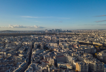 Fototapeta premium Flying above roofs of Paris, France, november 2017