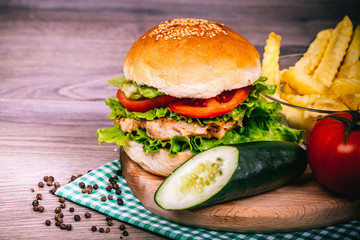 Delicious homemade hamburger with fresh salad and spices