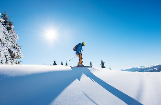 Full length shot of a skier on top of the mountain riding downhill copyspace active people living leisure hobby extreme freeride slope snow winter seasonal sport