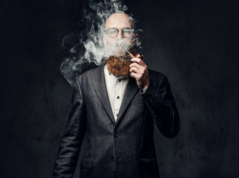 A man smoking tradition pipe.