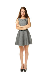 Portrait of young woman in dress on white background