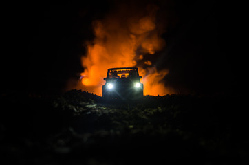 Police car chasing a car at night with fog background. 911 Emergency response police car speeding...