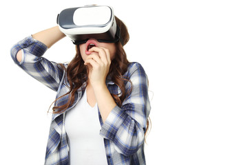 Young girl in virtual reality goggles on white background